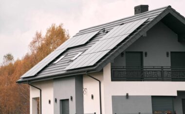 Modern home with rooftop solar panels designed for efficient solar panel maintenance and energy production.