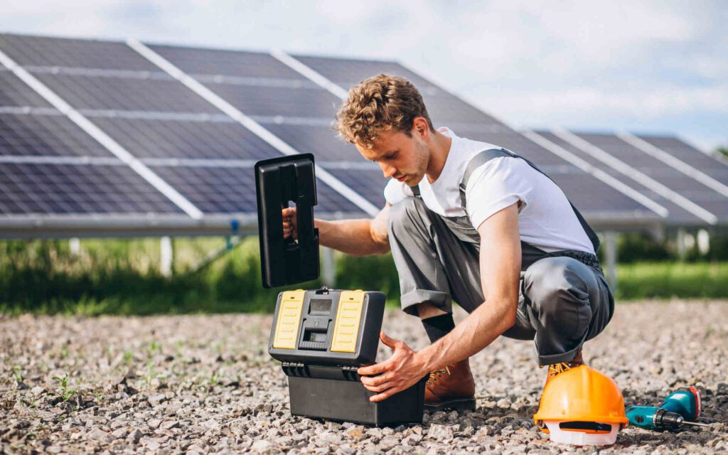 Technician performing solar panel repair on a residential rooftop system.
